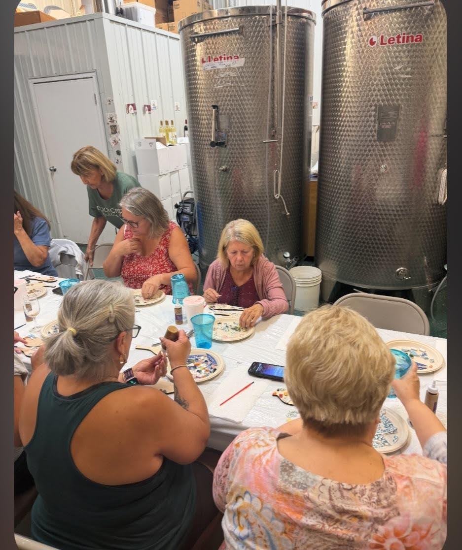 Guests painting mosaic pieces at a bird mosaic class hosted at Buck Creek Winery